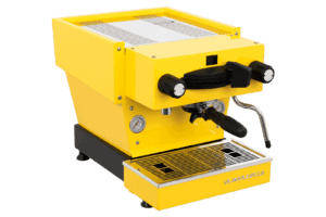 Badger and Dodo Coffee Roasters: The vibrant La Marzocco Linea Mini - Yellow espresso machine is equipped with a steam wand and two black front knobs. It includes a gauge, drip tray, stainless steel accents, and features branding in the bottom right corner for a sleek, modern design.