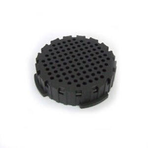Black plastic AeroPress filter cap with a circular shape and multiple small holes on the top surface.