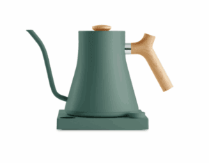 Modern electric gooseneck kettle in matte green with a natural wood handle and knob, placed on a matching green base.