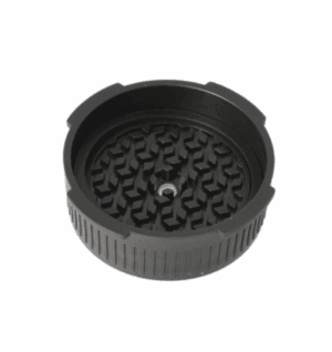 Black plastic or rubber grinder lid with a textured inner surface featuring interlocking teeth for Aeropress