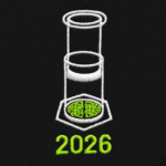 The image shows a close-up view of the embroidered design on a BlackT-shirt. The design features a white illustration of an AeroPress coffee maker, with a stylized coffee bed inside a hexagon at the bottom. Below the graphic, the year “2026” is stitched in bold white text.